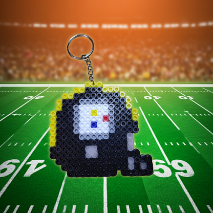 Pixelated keychain on a football field